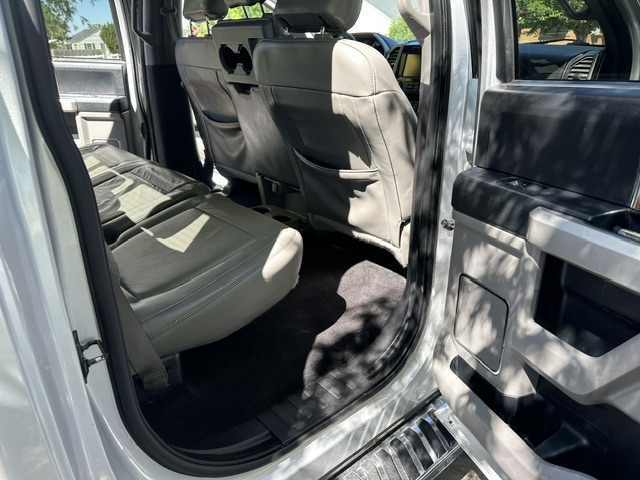 After interior detailing: clean rear seat backs and floor from the opposite side of a Ford F-150 Lariat