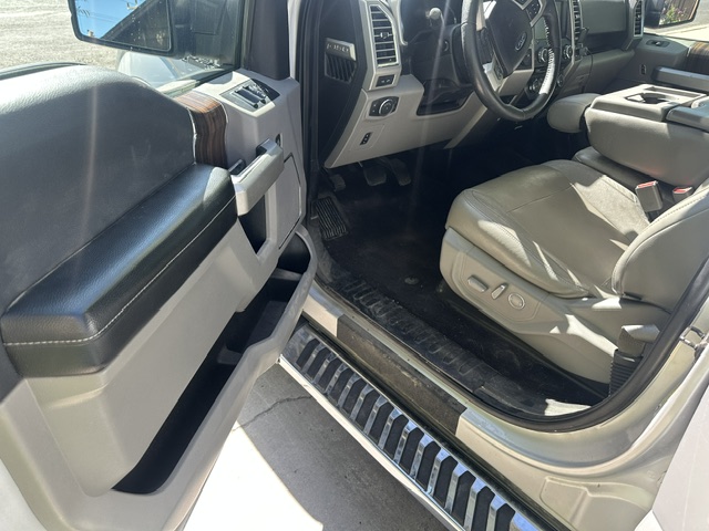 After interior detailing: clean rear seats, floor carpet, and door panel in a Ford F-150 Lariat