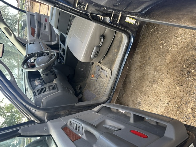 Before interior detailing: dusty dash, steering wheel and driver floor in a Dodge Durango