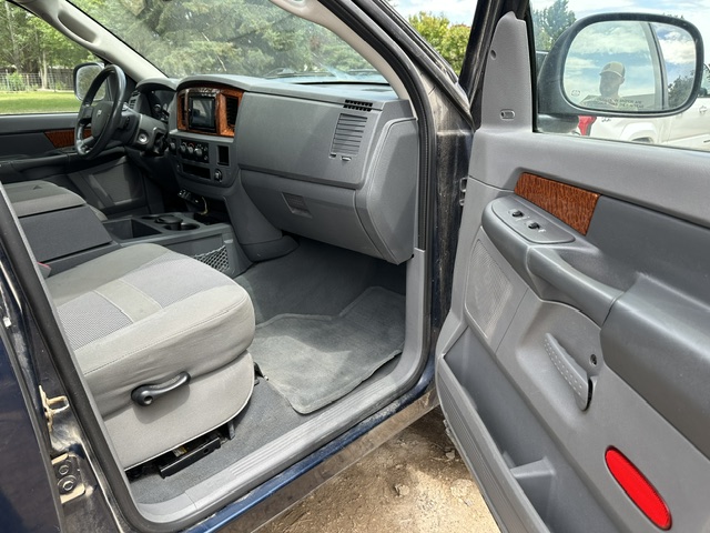 After interior detailing: clean passenger seat, dash and floor carpet in a Dodge Durango