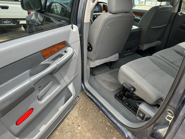 After interior detailing: clean rear footwell, floor mat and door panel in a Dodge Durango